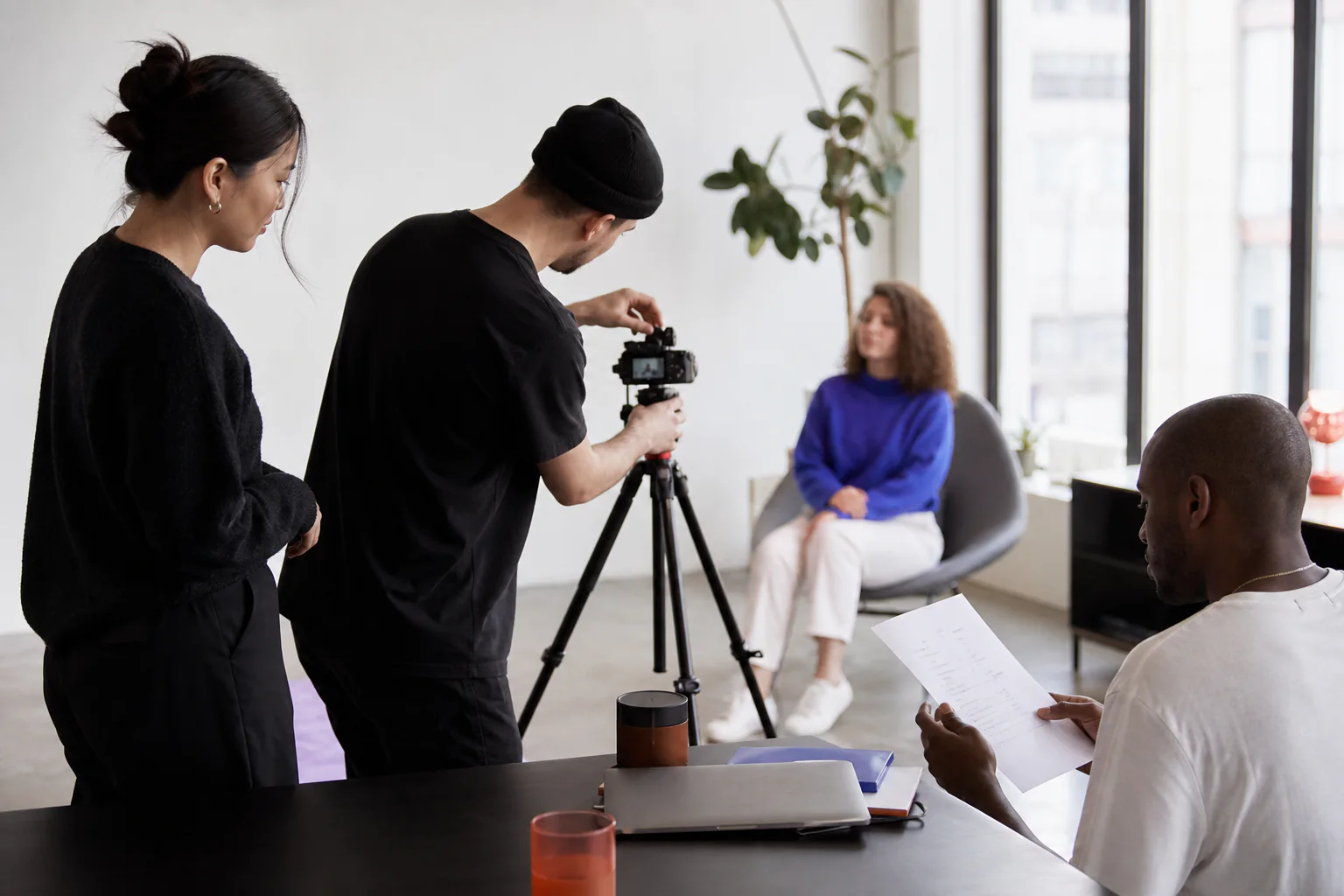 A team preparing a founder interview for social media